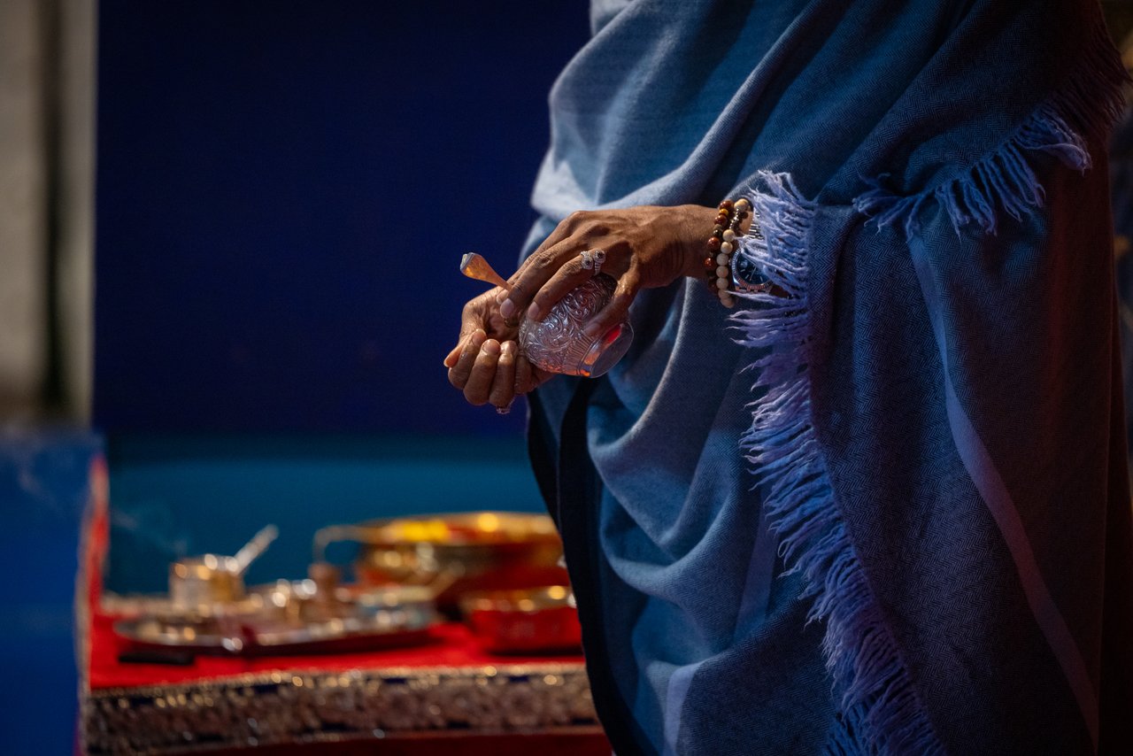 Hands holding a ritual object during practice