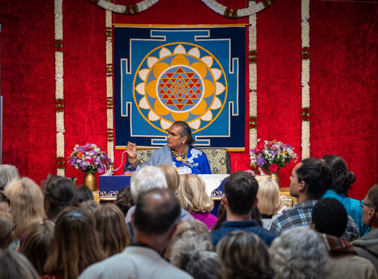 Paramahamsa Vishwananda smiling in red robes